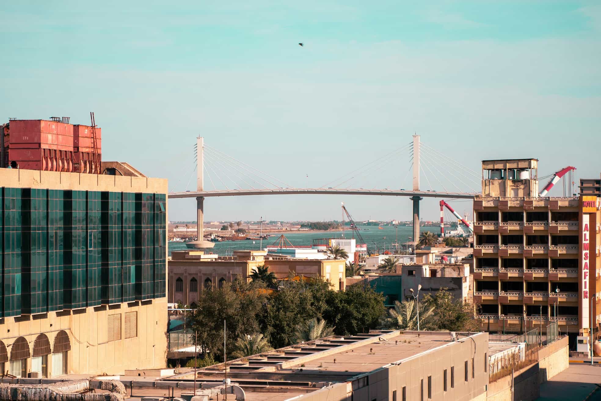 The skyline of Basra, Iraq, showing the Shatt al-Arab River bridge.